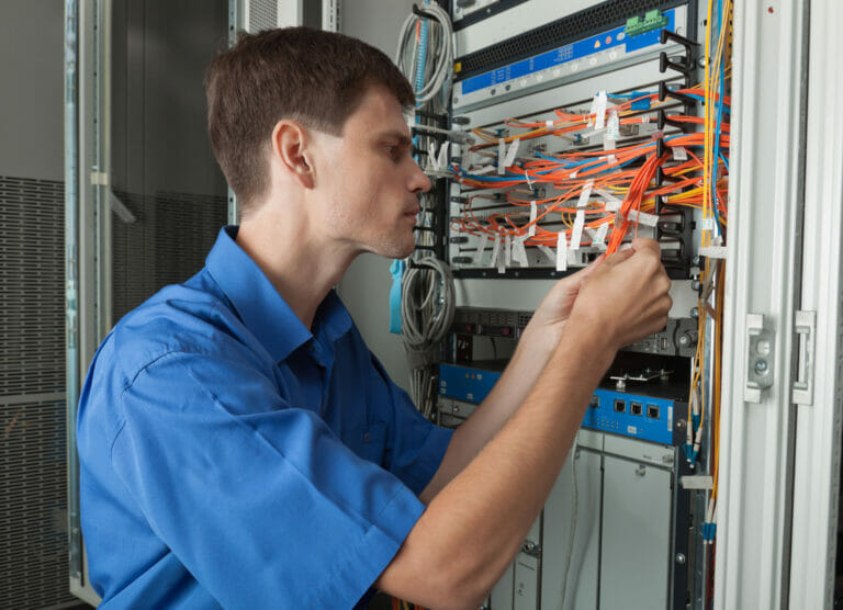 25612940 - senior  network engineer in server room wokinig